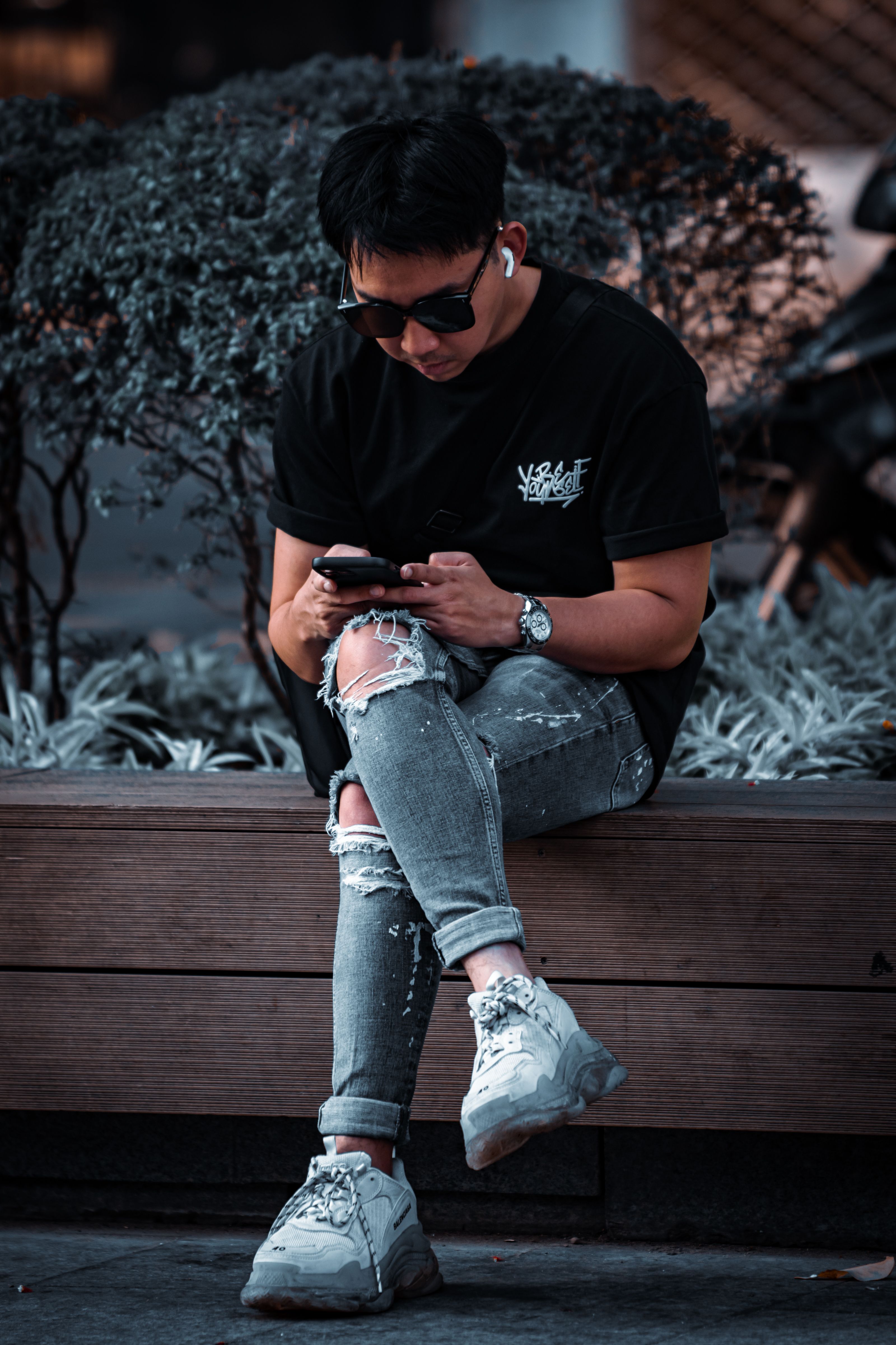 Sitting Man Using Smart Phone · Free Stock Photo
