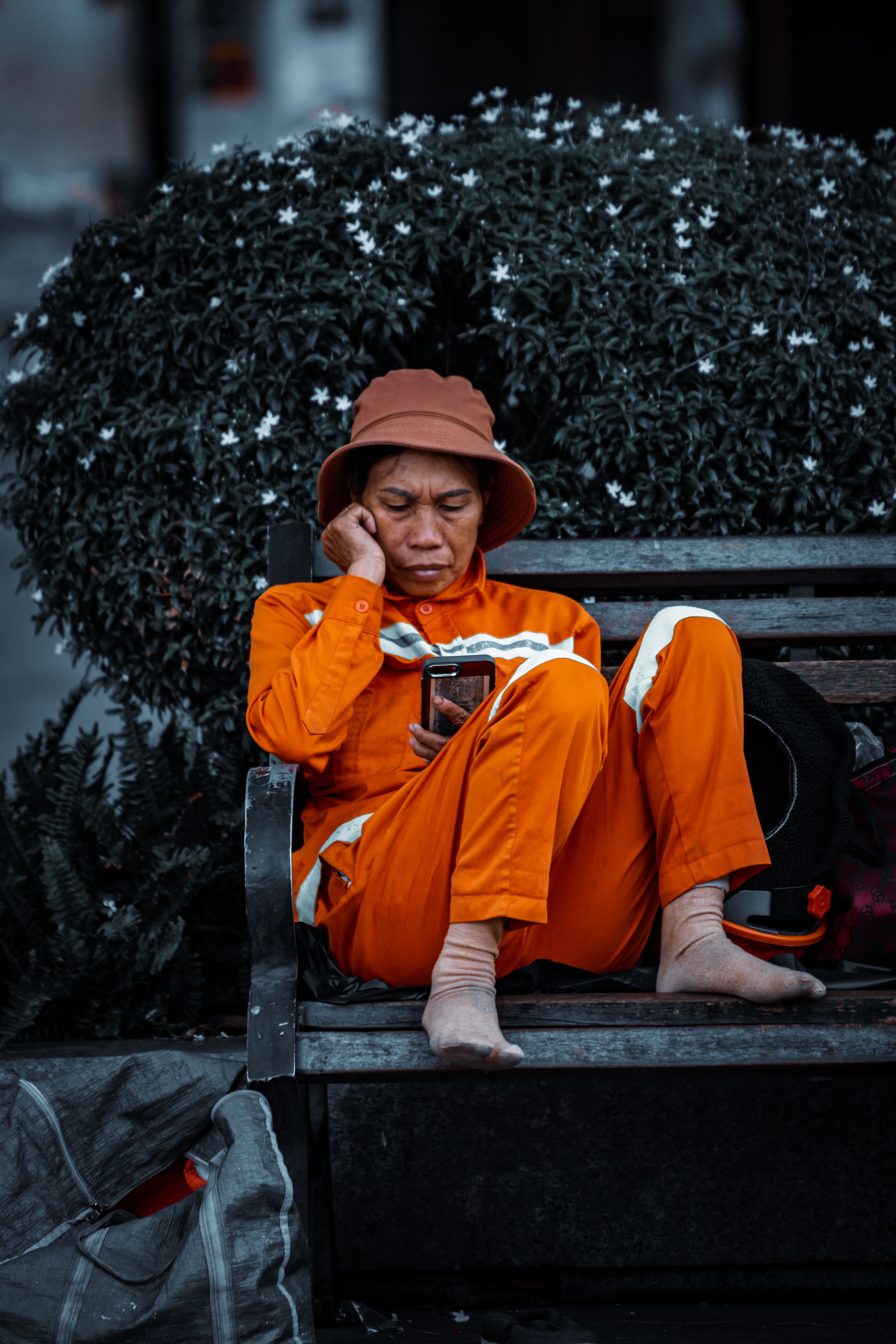 Woman in a Uniform Sitting on a Bench · Free Stock Photo