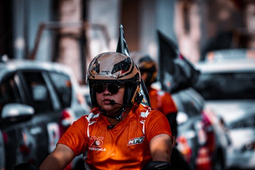 Biker Riding on Motorcycle with Jet Helmet on the Head