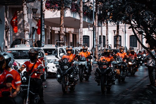 Parade of Bikers in Orange Shirts