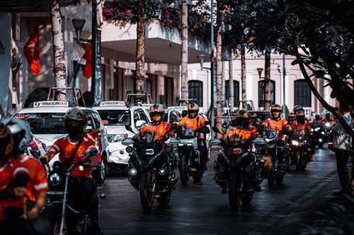 Free Motorcyclists ride in formation during a city street parade, displaying unity and organization. Stock Photo