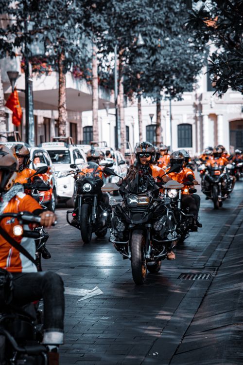 Free A dynamic scene of motorcyclists parading through city streets, showcasing urban lifestyle and leisure. Stock Photo