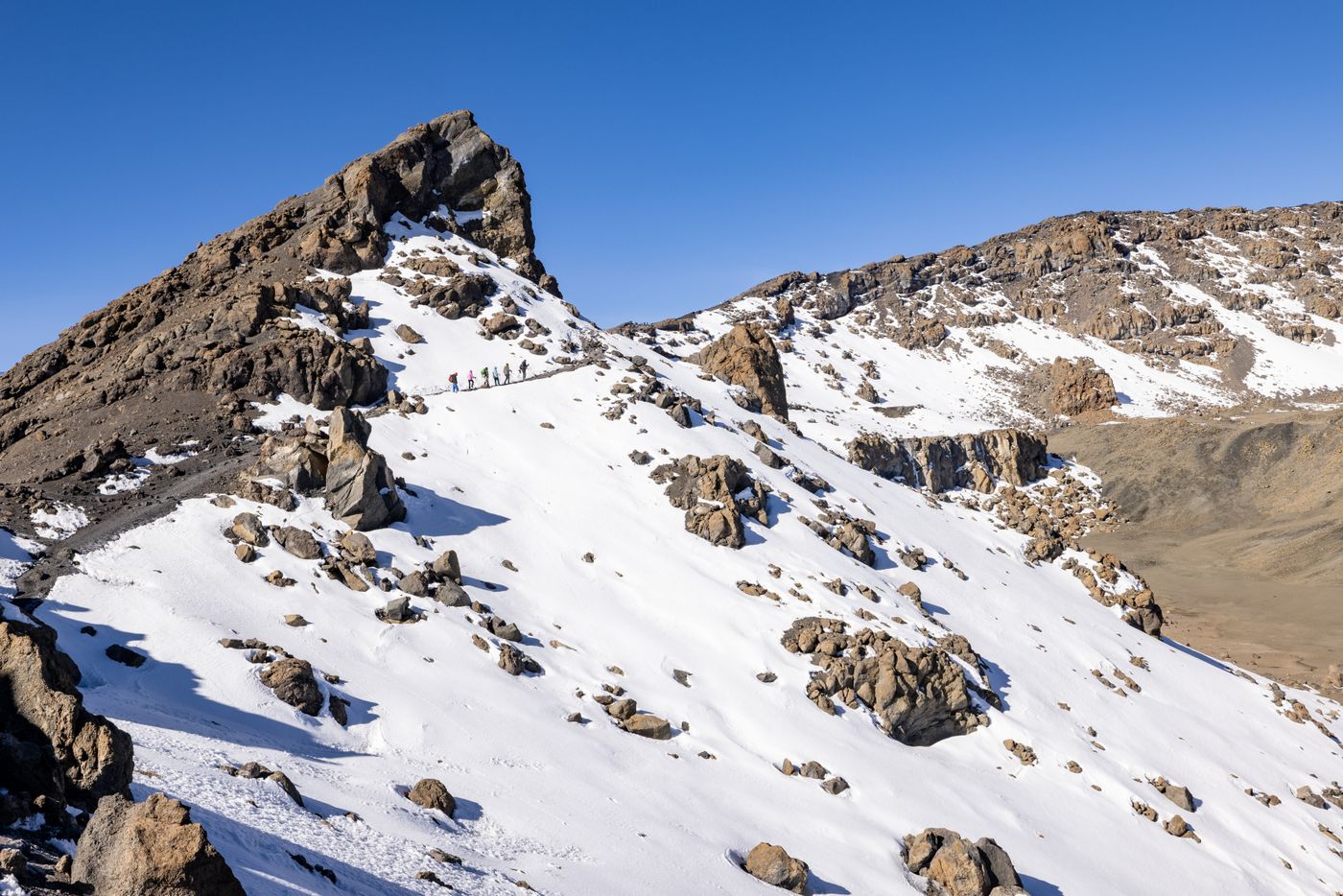 Climbers on the final snow slopes to Uhuru Peak