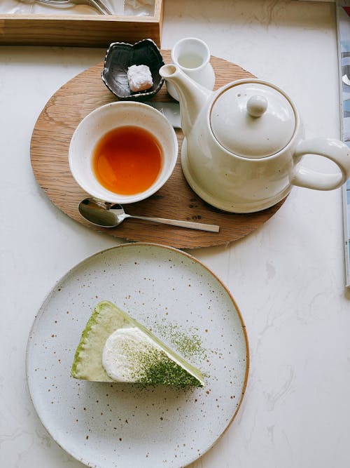 Tea in a Cup and a Slice of Cake on a Plate 