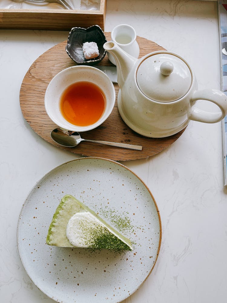 Tea In A Cup And A Slice Of Cake On A Plate 