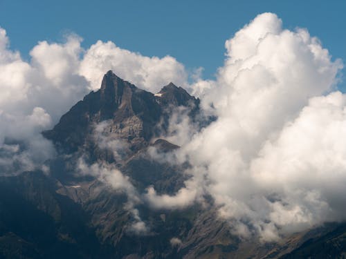 Landscape of a Mountain Peak between Clouds 
