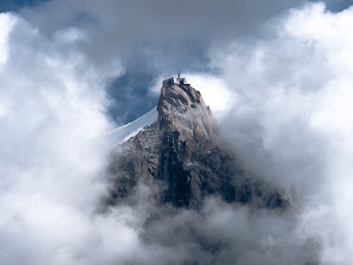 A Rocky Mountain Peak between Clouds 
