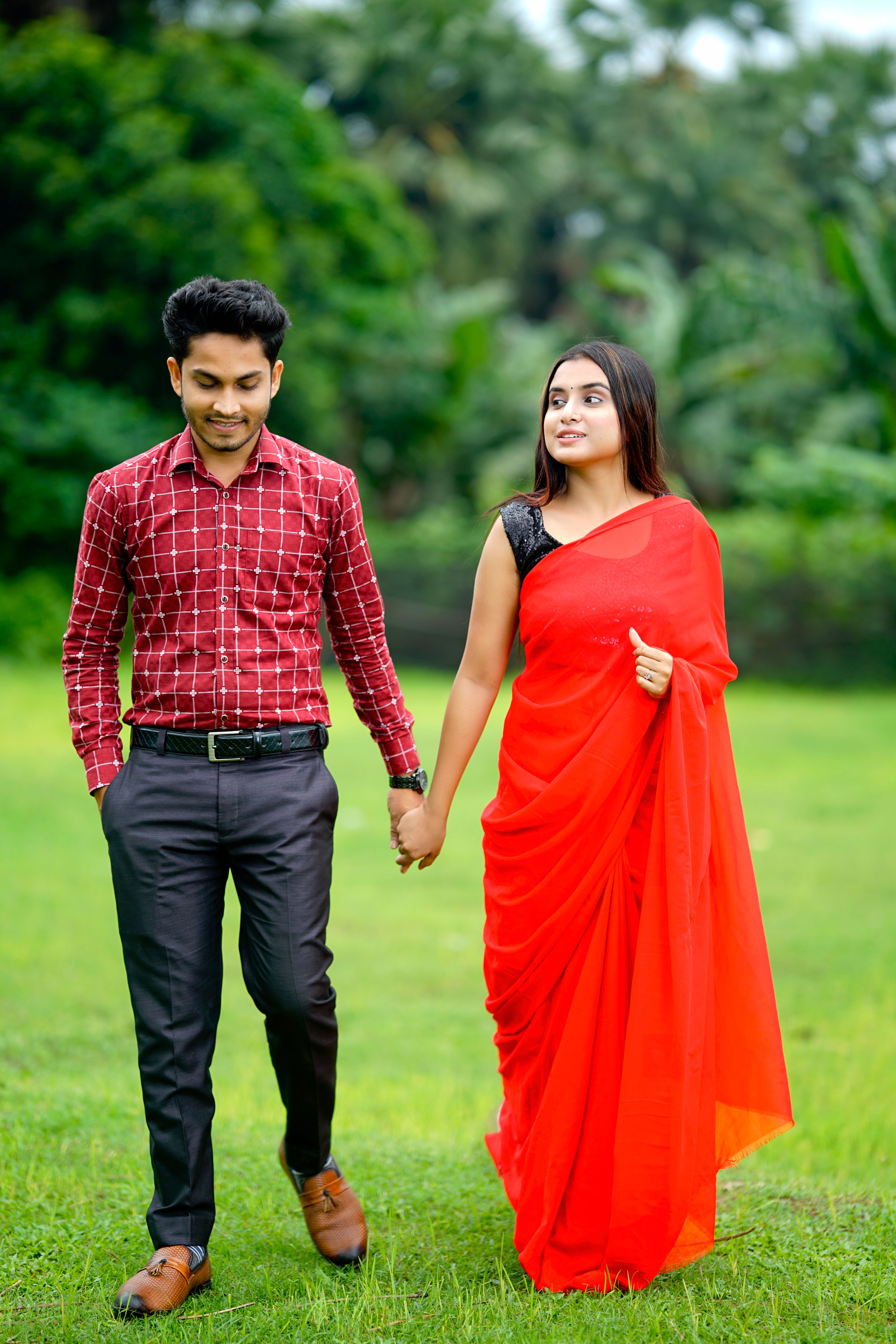 Romantic Couple Holding Hands In Park Free Stock Photo