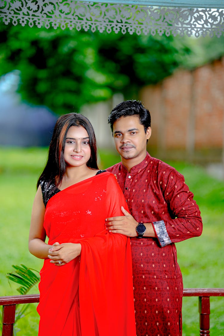 Smiling Couple Posing In Traditional Indian Clothes