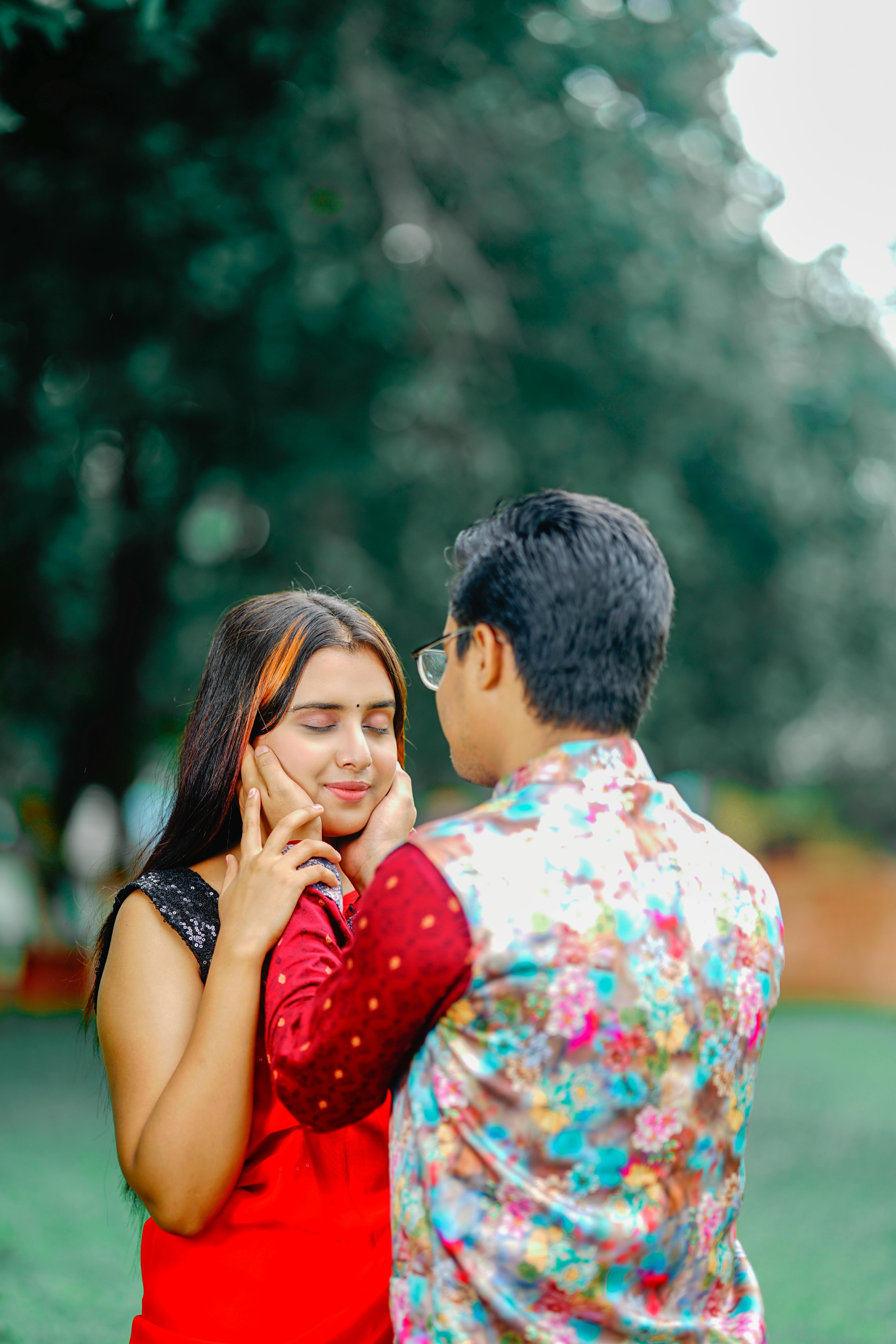 Beautiful young couple hugging, looking at camera and smiling - a Royalty  Free Stock Photo from Photocase