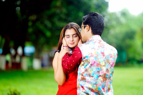 Young Couple Hugging in a Park 