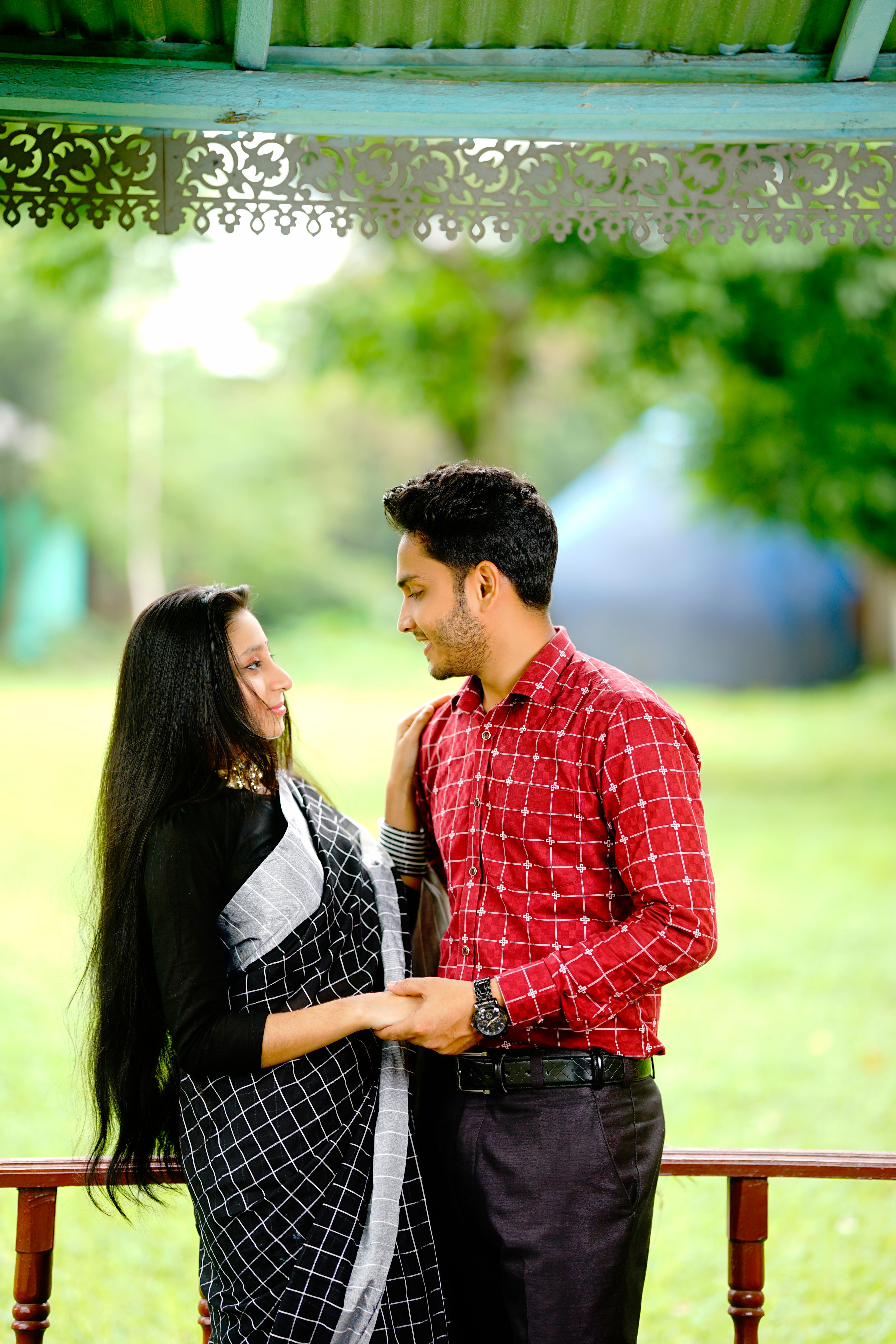 Young Couple in Traditional Clothing in a Park · Free Stock Photo