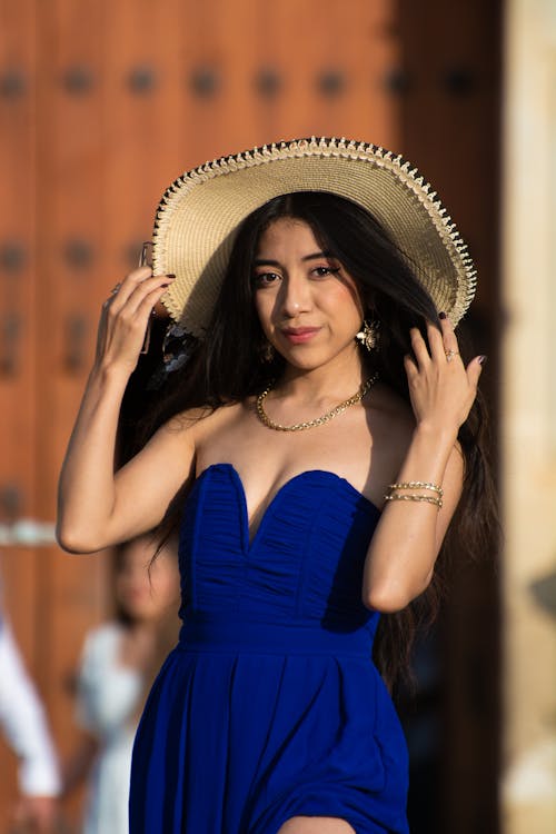 Photo of a Beautiful Young Woman in a Summer Hat