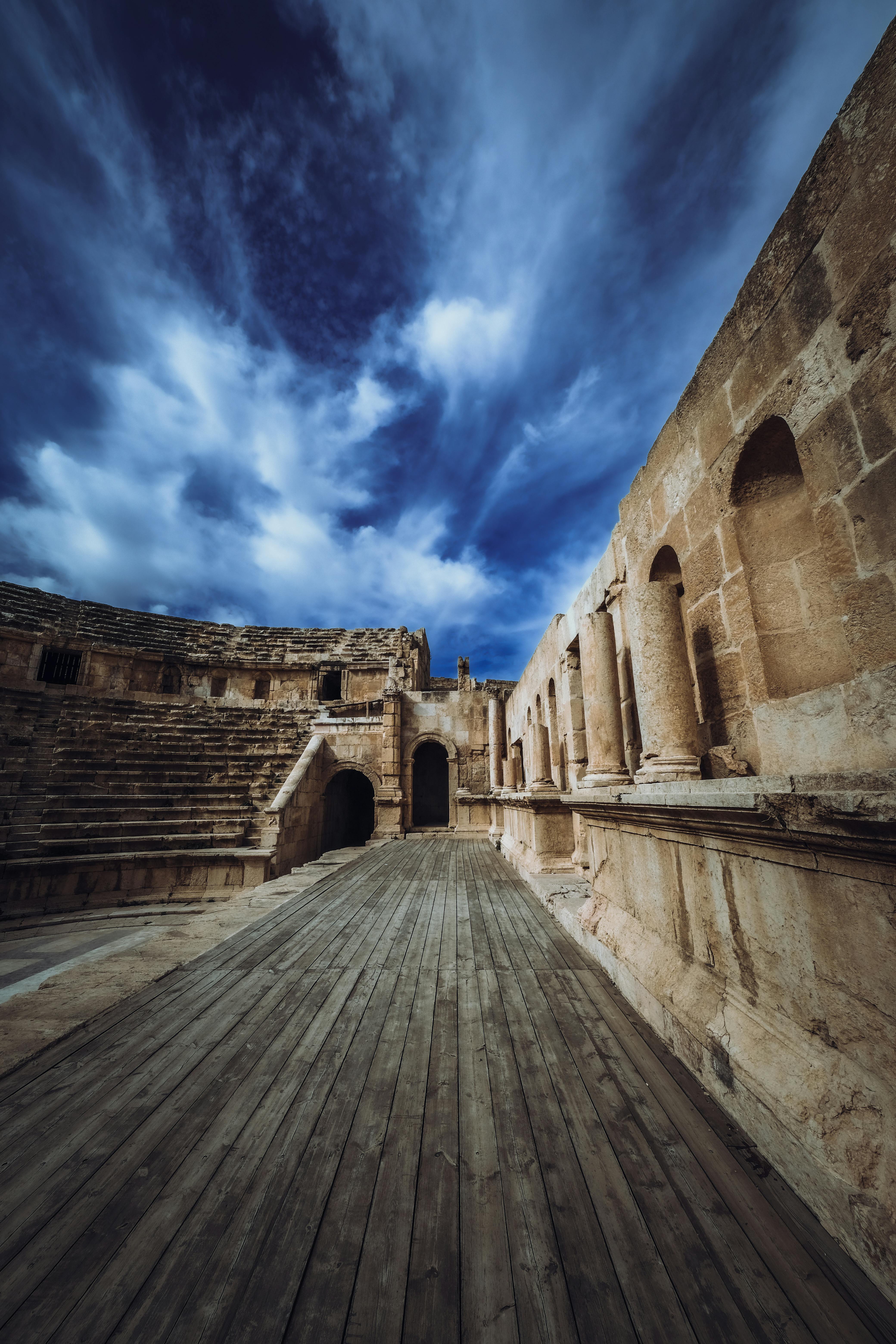 Free Explore the ruins of an ancient Roman theatre under a vivid blue sky. Stock Photo