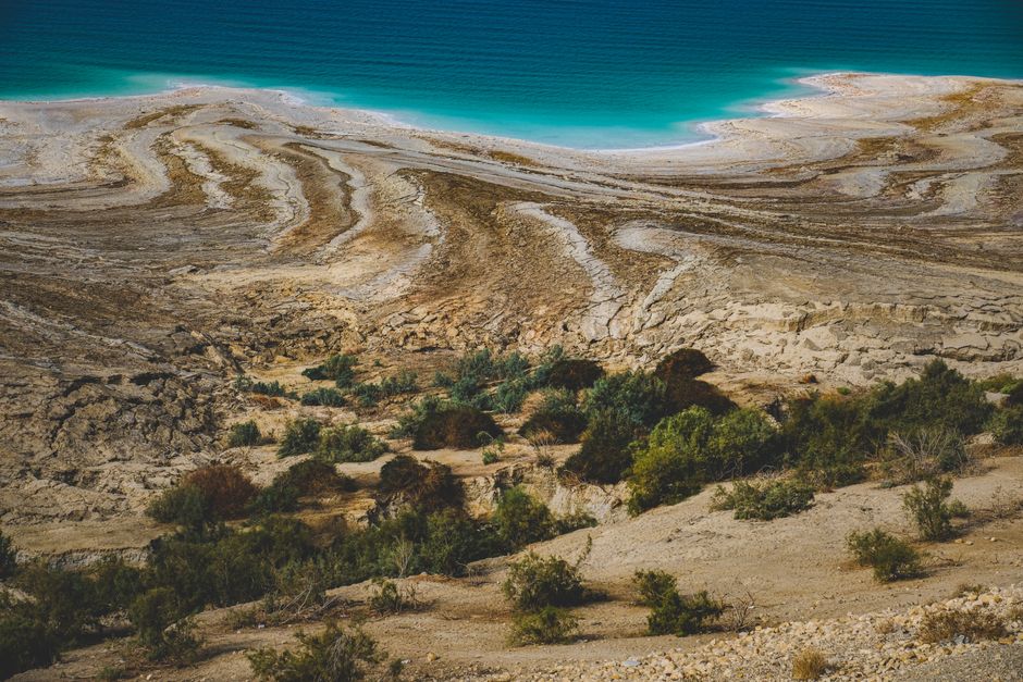 Person floating in the Dead Sea, Jordan, with a focus on health and safety in unique environments.