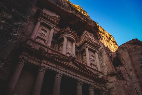 Free Captivating image of Al-Khazneh, the iconic temple in the ancient city of Petra at sunset. Stock Photo