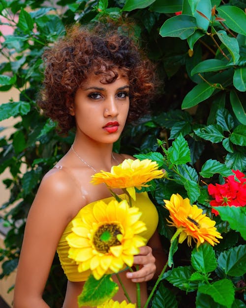 Young Model with Sunflowers in the Garden