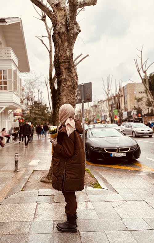 Woman Standing on City Street