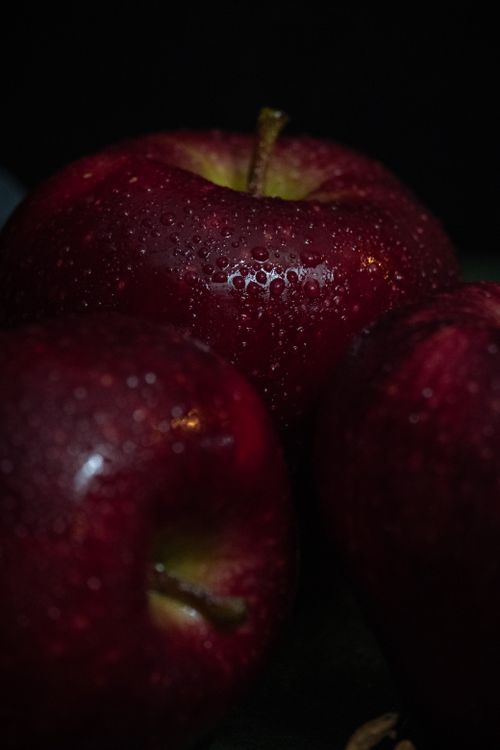 Free Close-up of fresh red apples with water droplets creating a healthy food theme. Stock Photo
