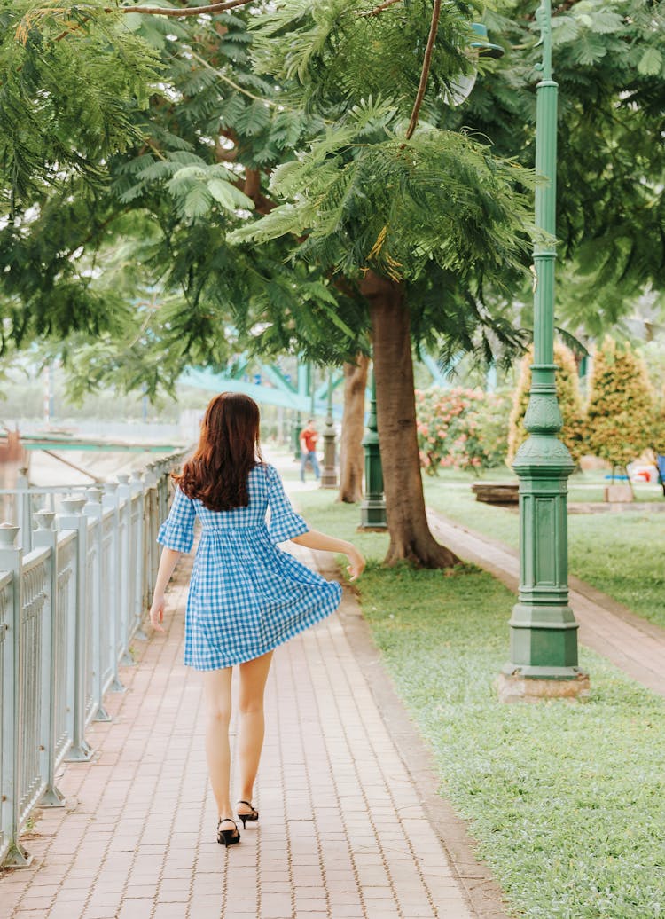 Woman Walking At The Park