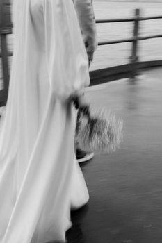 Capturing a bride and groom walking in Istanbul in an artistic black and white style.
