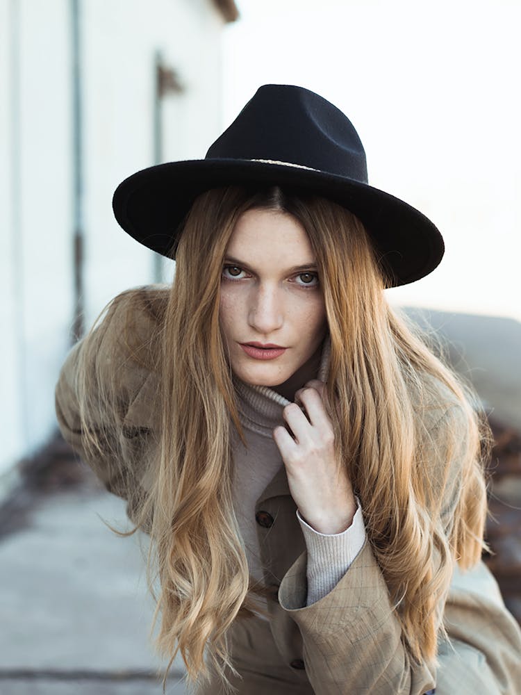 A Beautiful Young Woman Wearing A Hat