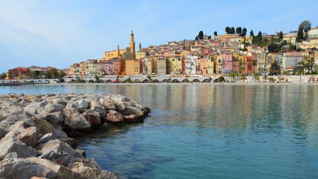 Vibrant architecture and Mediterranean coast of Menton, France captured in a scenic view.