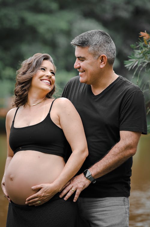 Smiling Pregnant Woman Posing with Man