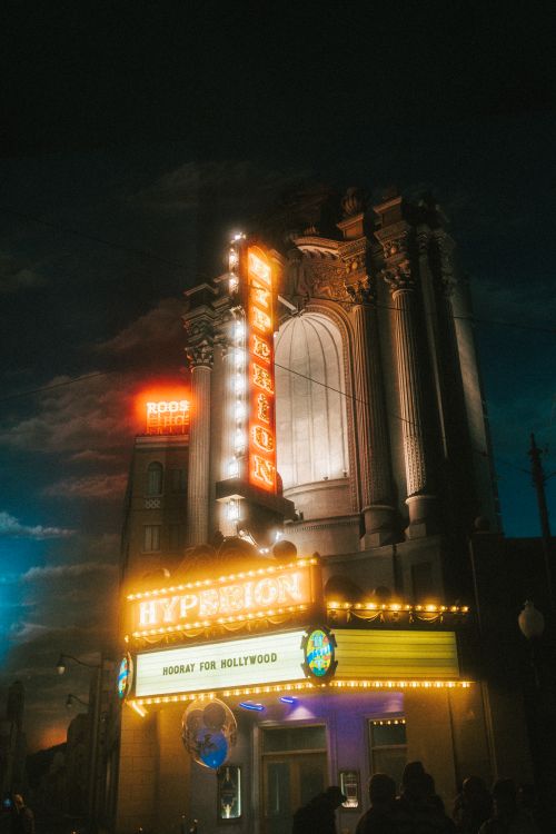 Free Stunning illuminated facade of the Hyperion Theater showcasing bright neon lights during a vibrant night. Stock Photo
