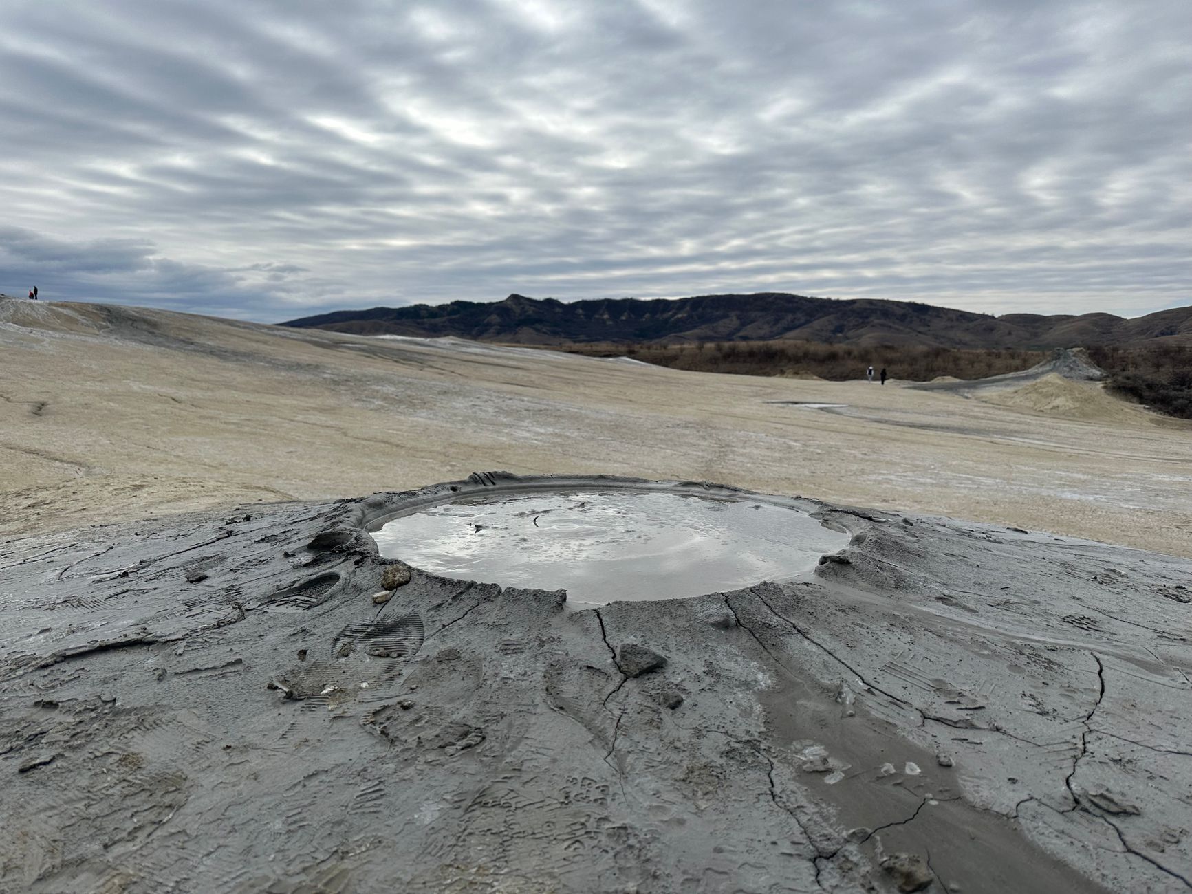 A stunning view of Pâclele mud volcano in Romania, showcasing unique geological features. — photo by lgg pics / Pexels