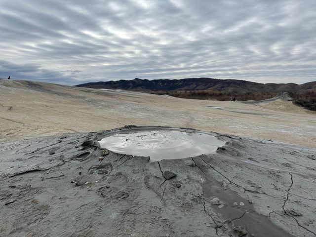 A stunning view of Pâclele mud volcano in Romania, showcasing unique geological features.