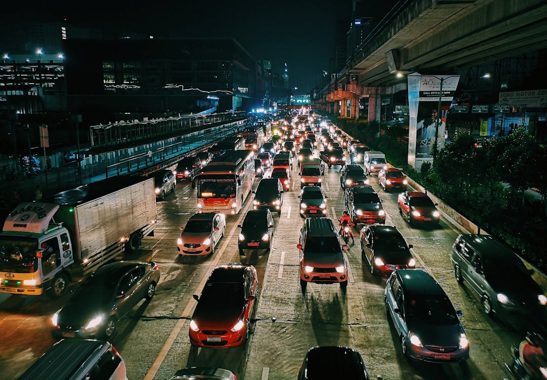 Photo of Vehicles On Road During Evening