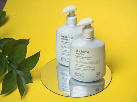 Sesderma Salises skin cream on mirror with yellow background, showcasing soothing skincare routine.