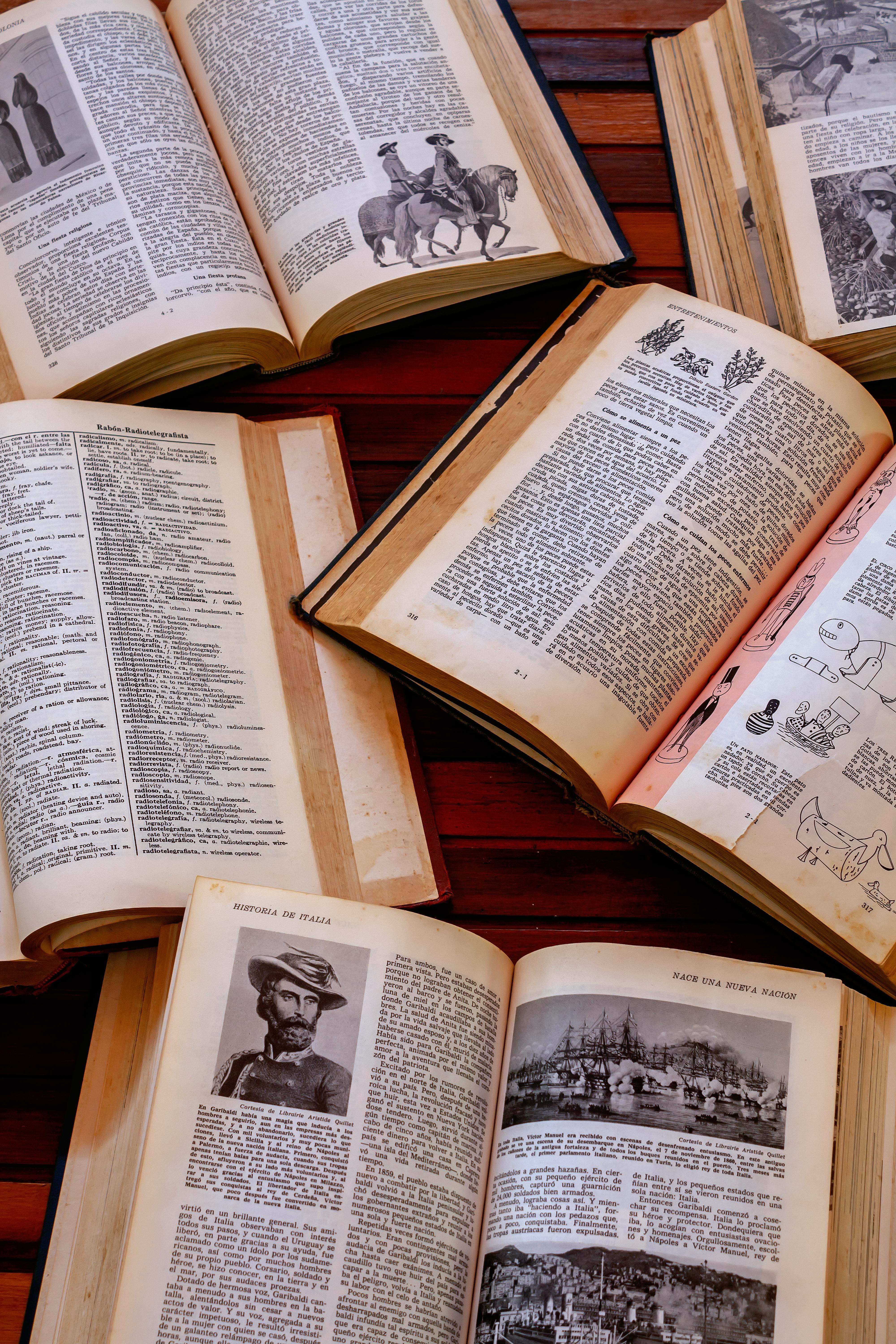 a collection of old books on a table