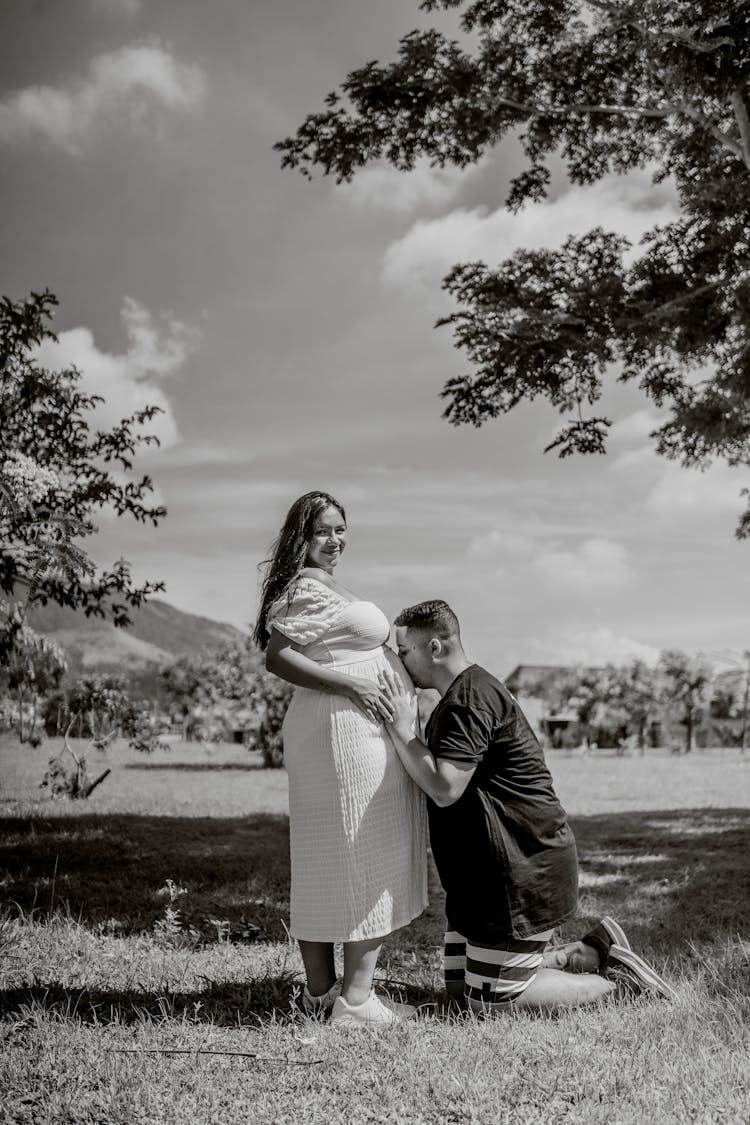 Man Kissing Pregnant Woman Belly