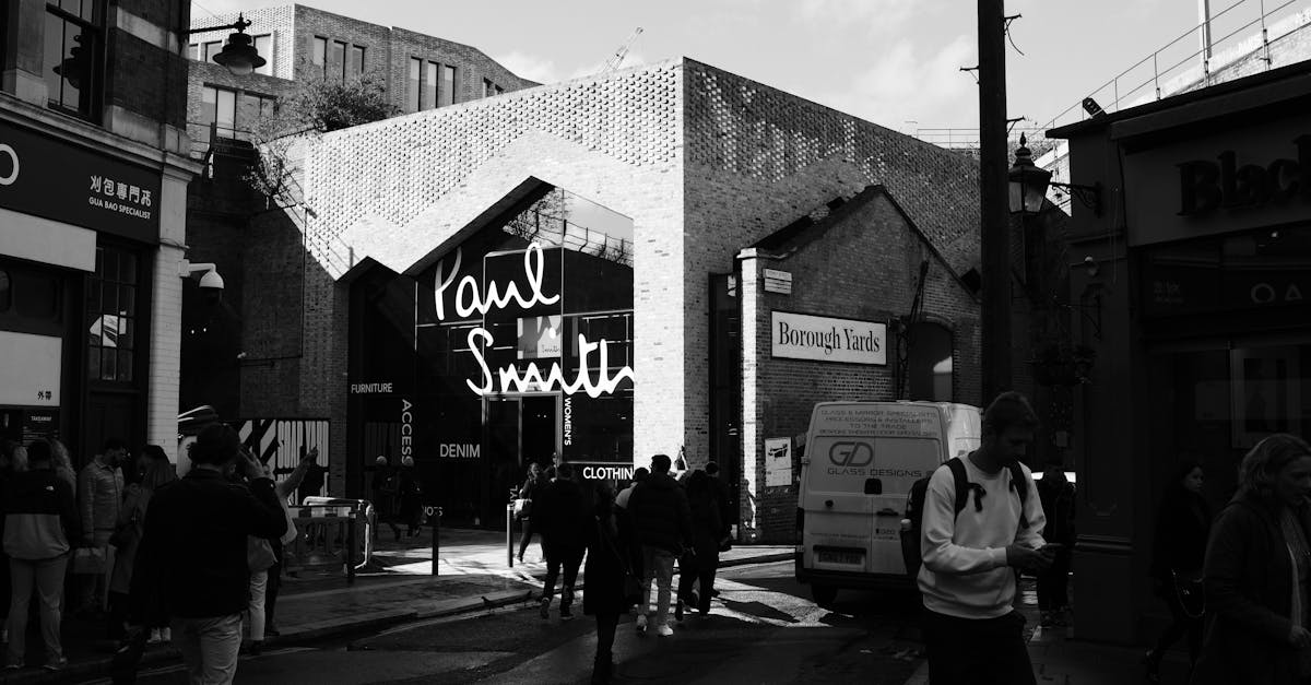 Black and white street photo of Borough Yards in London with people walking.