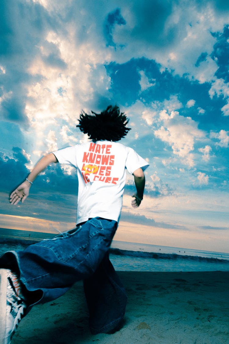 Man Running Along Beach