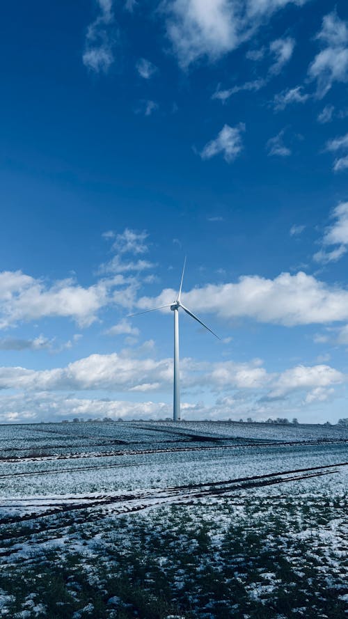 A Wind Turbine Standing on a Frosty Hill 