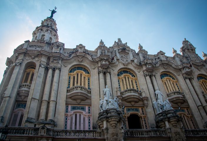 Stunning baroque architectural facade in Havana, Cuba under a clear blue sky.