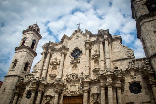 Free Close-up of the Havana Cathedral against blue sky, capturing its baroque architecture. Stock Photo