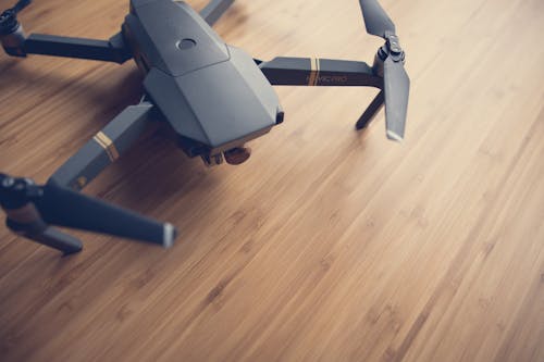 Free Quadcopter On Wooden Surface Stock Photo