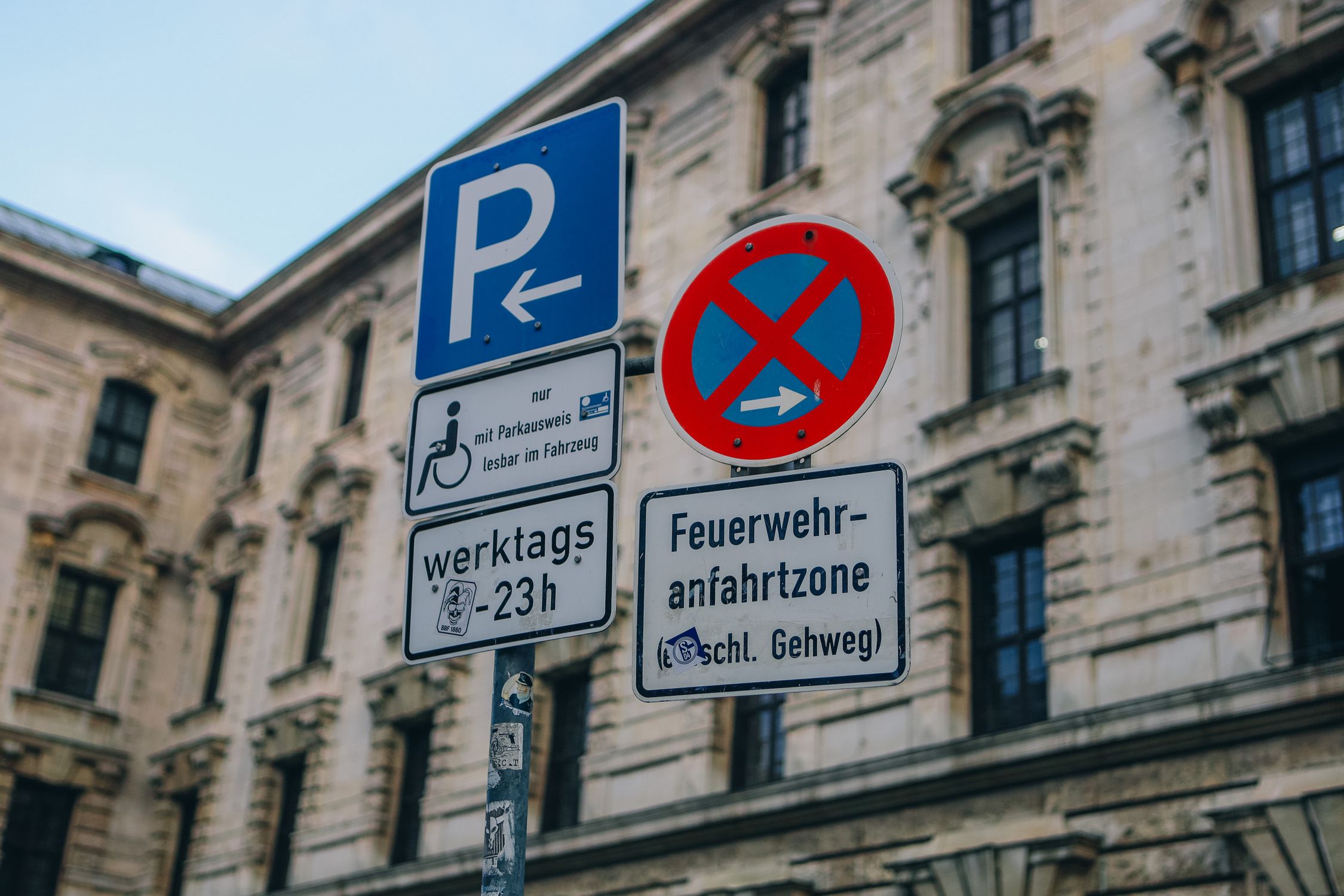 Road Signs on the Background of a Traditional Building in City · Free ...