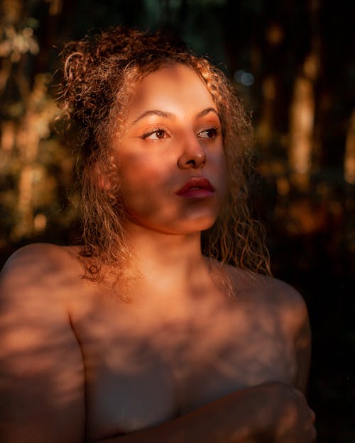 Young Topless Woman Standing Outside in Sunlight 