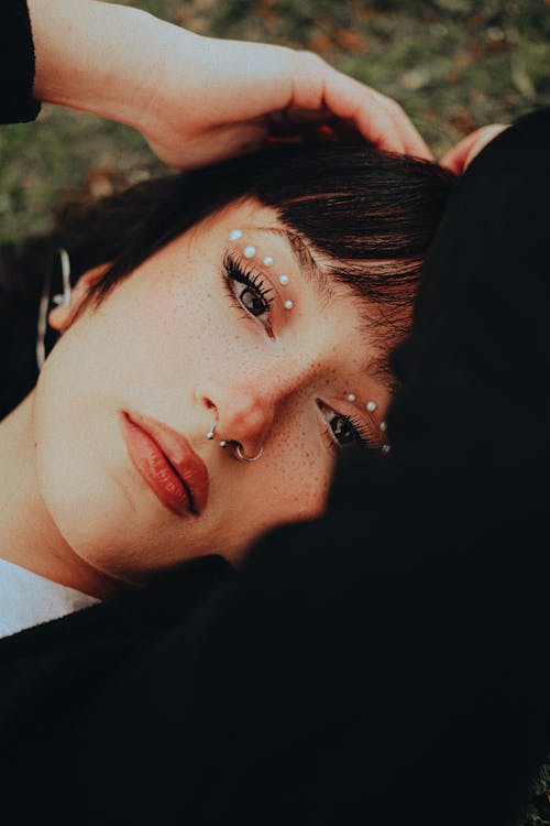 Portrait of Woman Lying on Grass