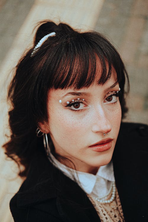 Young Brunette with Bangs Wearing an Elegant Outfit 