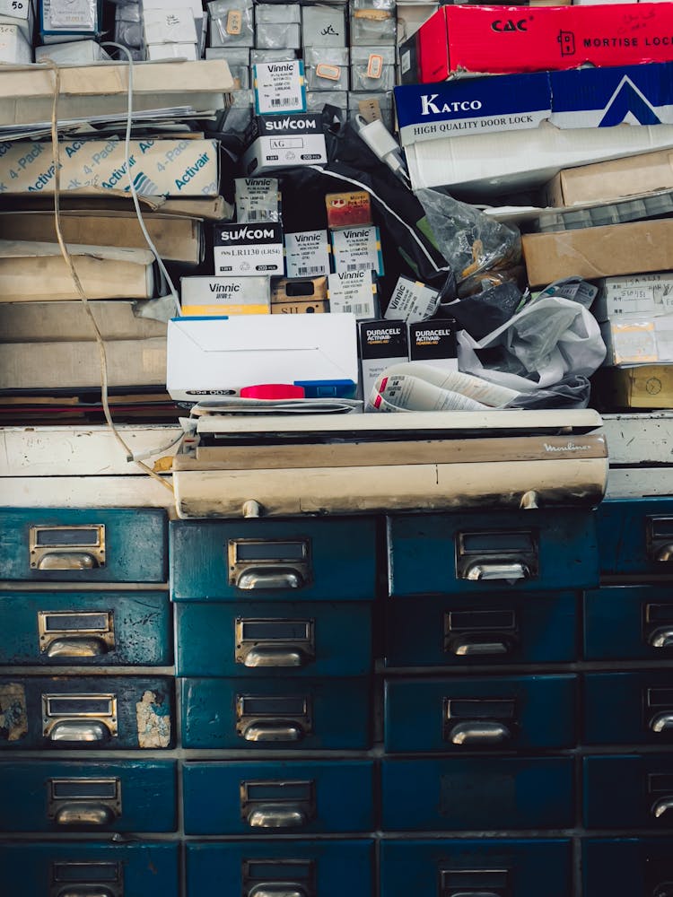 Old Drawers And A Stack Of Products In Boxes 