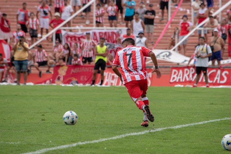 Football Player Playing On Stadium