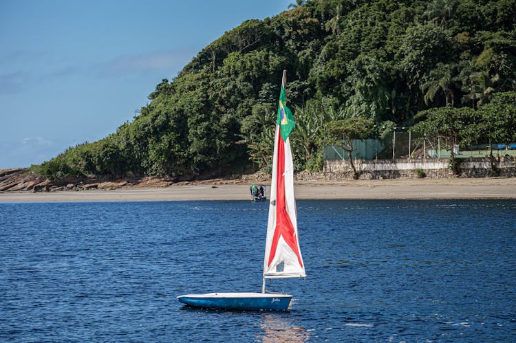 Empty Sailboat On Sea Shore