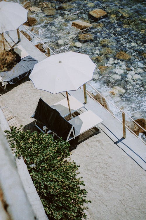 High Angle View of Sun Loungers and a Beach Umbrella 