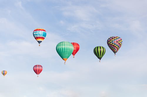 Flight of Colorful Hot Air Balloons